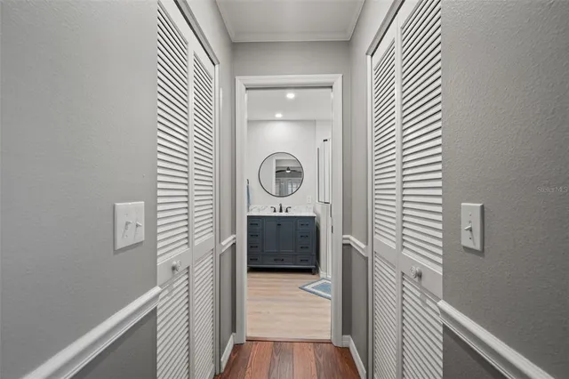 an aerial view of residential houses with outdoor space and street view