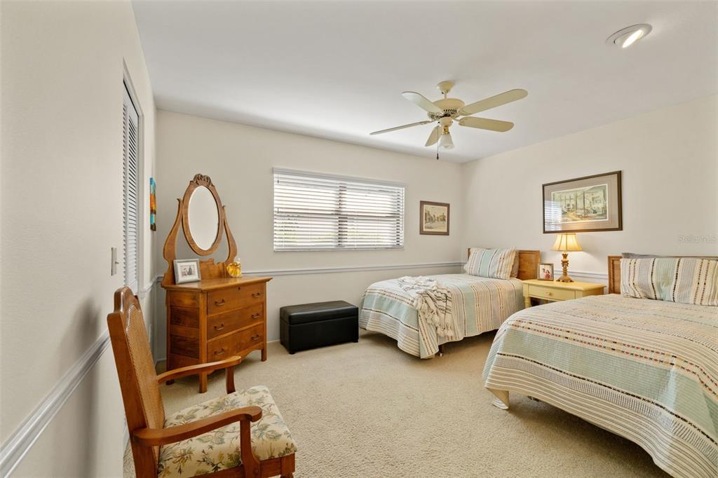 2647 Royal Ridge Drive Spring Hill, FL 34606 - Photo 48 of 73 a bedroom with two beds and a window