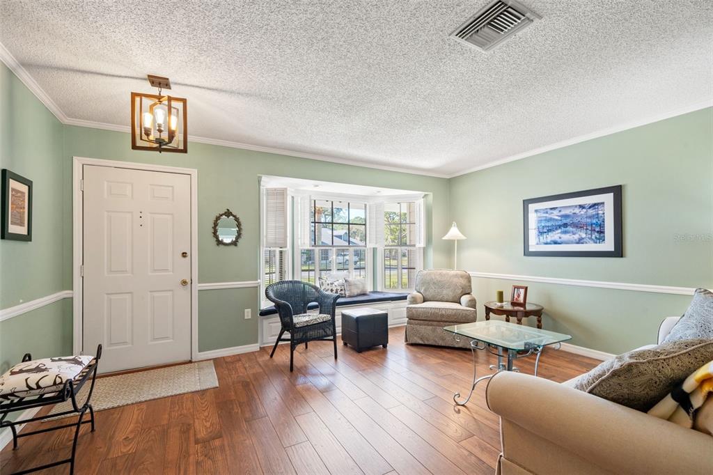 2647 Royal Ridge Drive Spring Hill, FL 34606 - Photo 8 of 73 a living room with furniture and a wooden floor