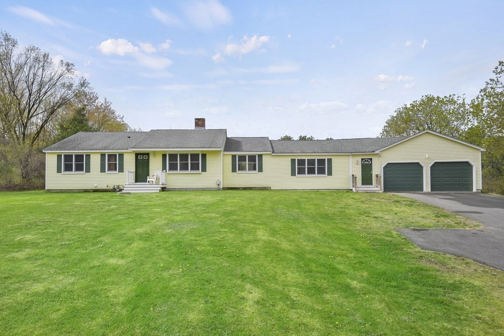78 Little Turnpike Road Shirley, MA 01464 - Photo 1 of 1 a front view of a house with a garden