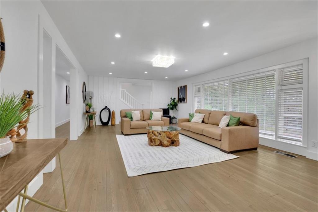 3018 West Pine Valley Road Northwest Atlanta, GA 30305 - Photo 11 of 47 a living room with furniture and wooden floor
