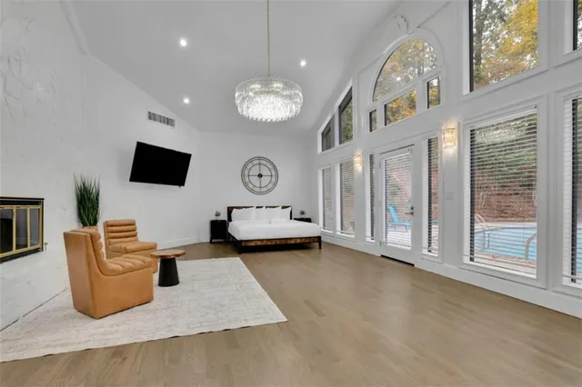 a view of a livingroom with furniture and a flat screen tv