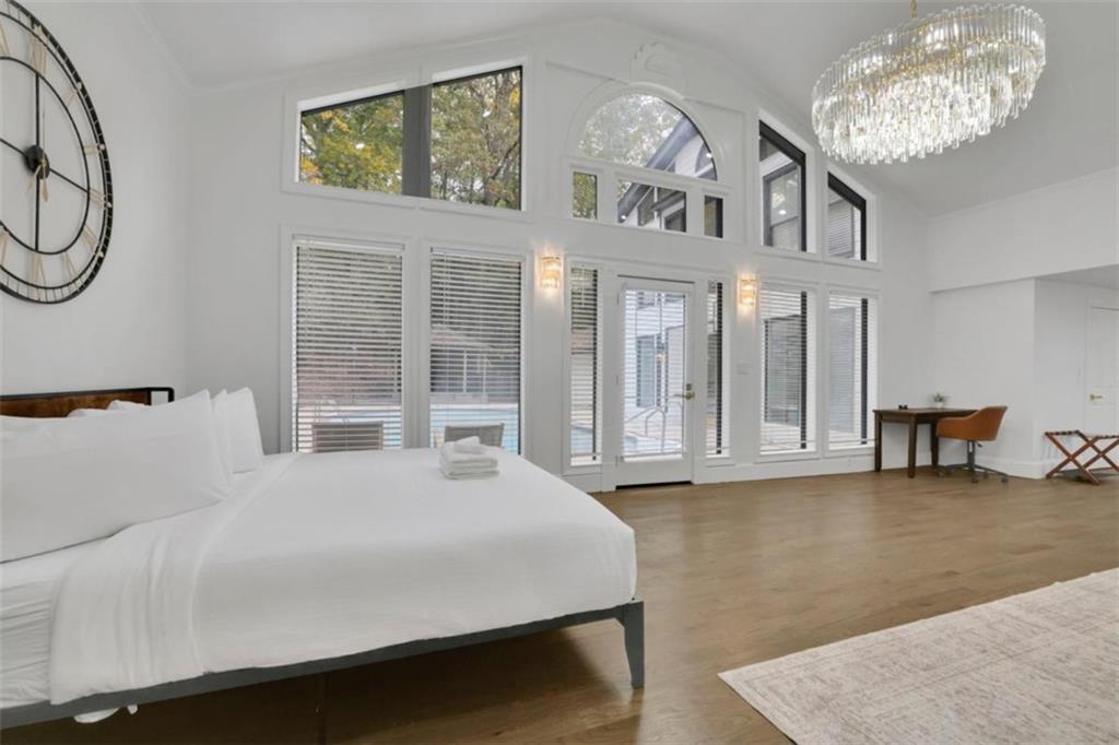 3018 West Pine Valley Road Northwest Atlanta, GA 30305 - Photo 15 of 47 a large white bed sitting in a room next to a window
