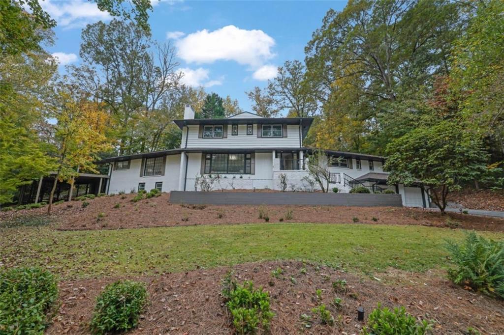 3018 West Pine Valley Road Northwest Atlanta, GA 30305 - Photo 22 of 47 a view of a house with a yard