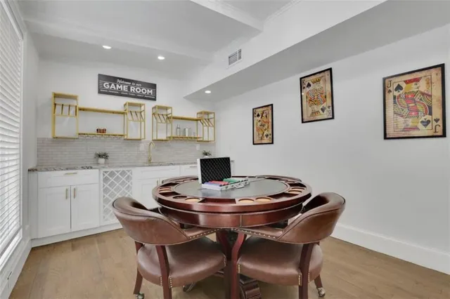 a kitchen with a dining table and chairs