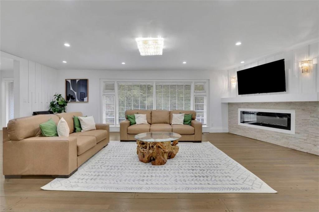 3018 West Pine Valley Road Northwest Atlanta, GA 30305 - Photo 3 of 47 a living room with furniture and a flat screen tv