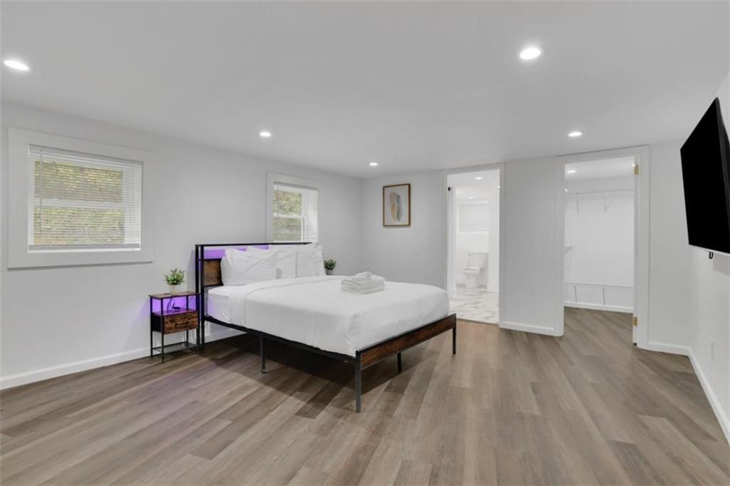 3018 West Pine Valley Road Northwest Atlanta, GA 30305 - Photo 35 of 47 a room with a bed and a flat screen tv