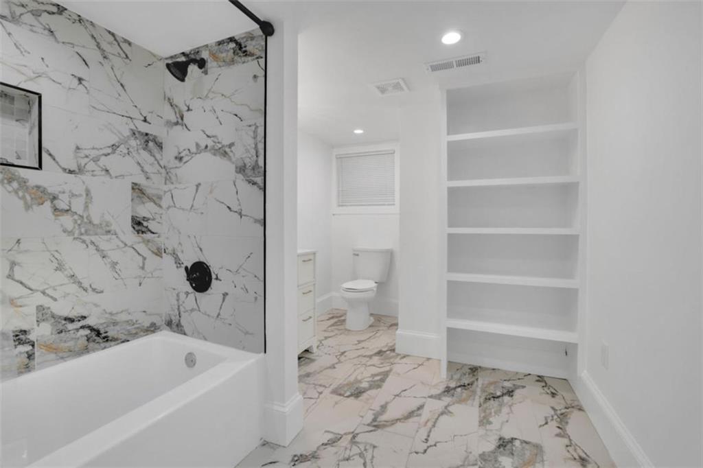 3018 West Pine Valley Road Northwest Atlanta, GA 30305 - Photo 37 of 47 a bathroom with a bathtub and a toilet