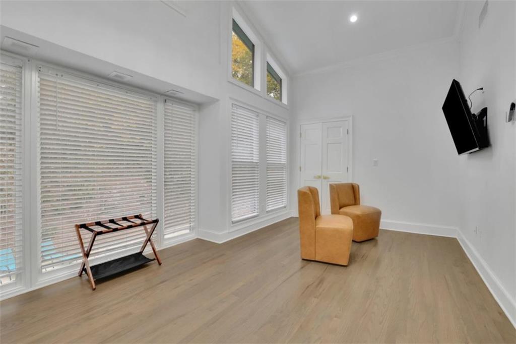 3018 West Pine Valley Road Northwest Atlanta, GA 30305 - Photo 38 of 47 a living room with furniture and a flat screen tv