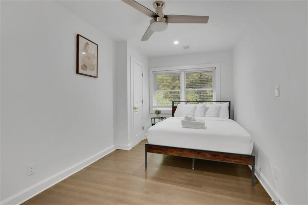 3018 West Pine Valley Road Northwest Atlanta, GA 30305 - Photo 40 of 47 a bedroom with a bed and a table