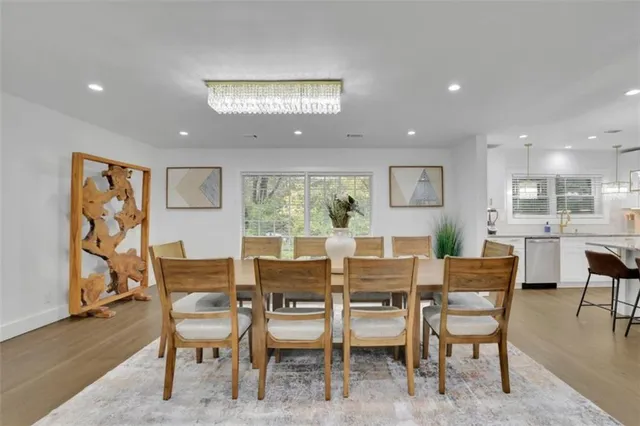 a view of a dining room with furniture window and wooden floor