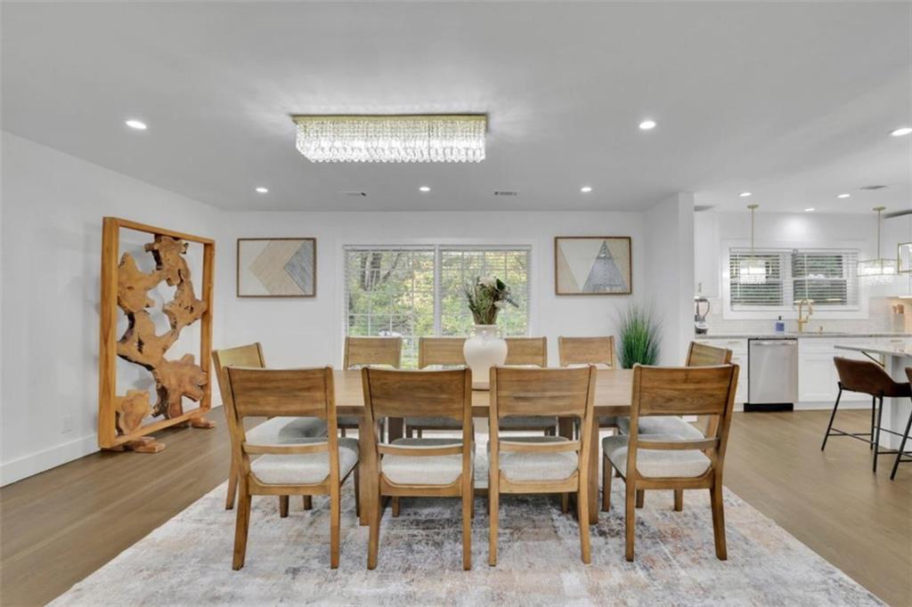 3018 West Pine Valley Road Northwest Atlanta, GA 30305 - Photo 4 of 47 a view of a dining room with furniture window and wooden floor