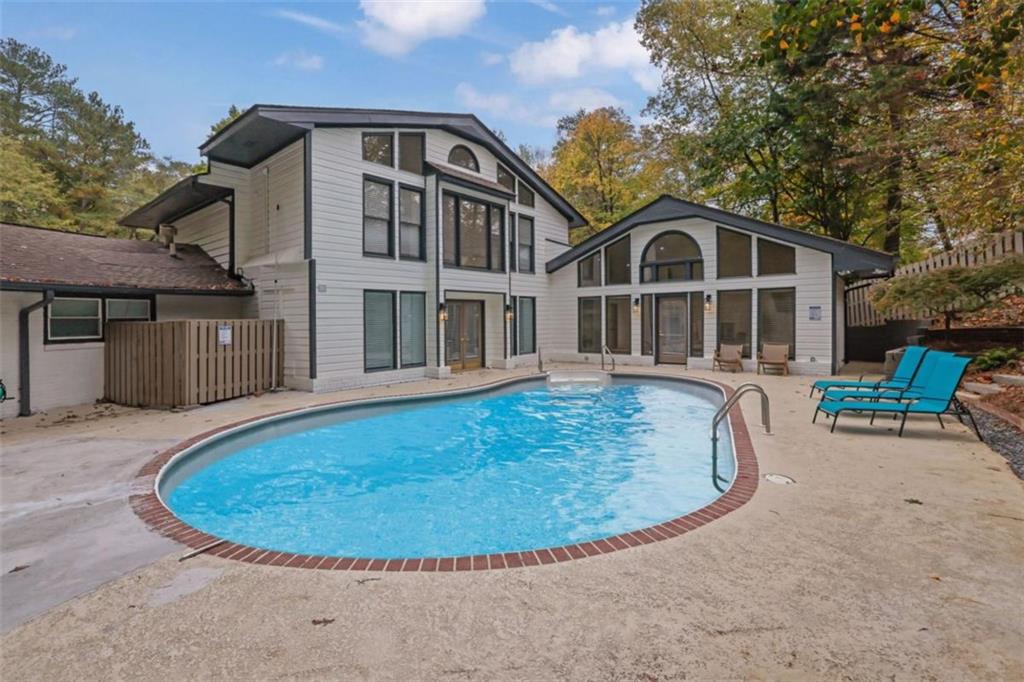3018 West Pine Valley Road Northwest Atlanta, GA 30305 - Photo 45 of 47 a view of a house with a swimming pool