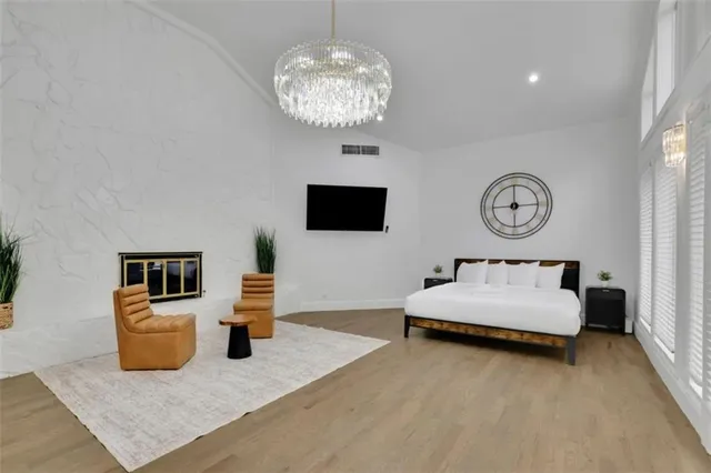 a bedroom with bed and window