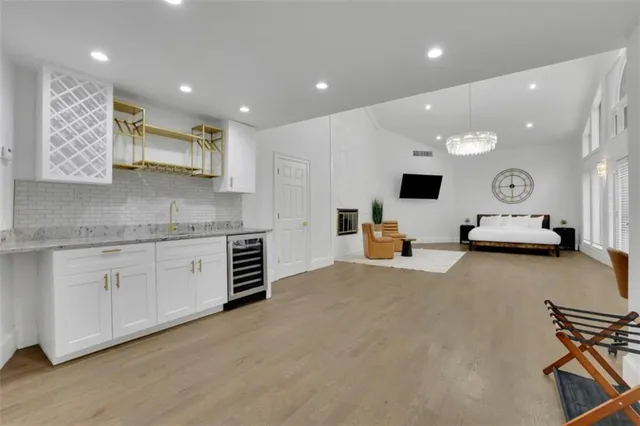 a kitchen with a sink and a stove top oven