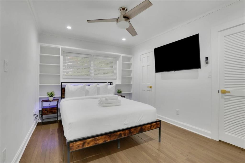 3018 West Pine Valley Road Northwest Atlanta, GA 30305 - Photo 10 of 47 a bedroom with a bed and a flat screen tv