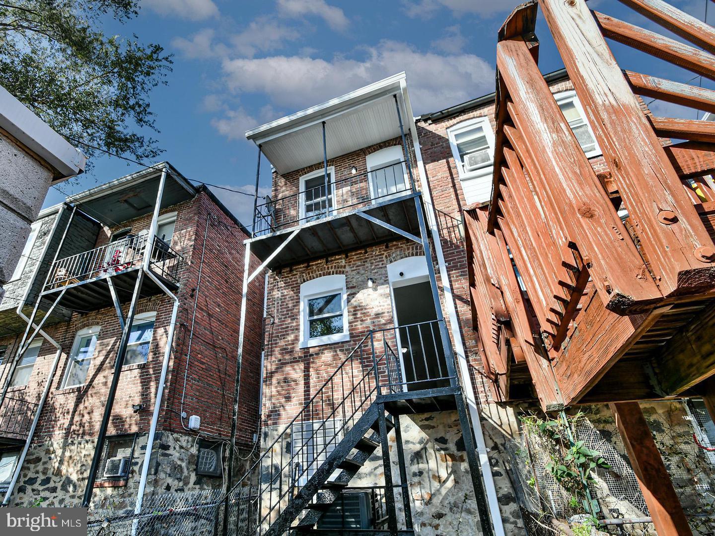2605 Kirk Avenue Baltimore, MD 21218 - Photo 15 of 17 a front view of a house with balcony