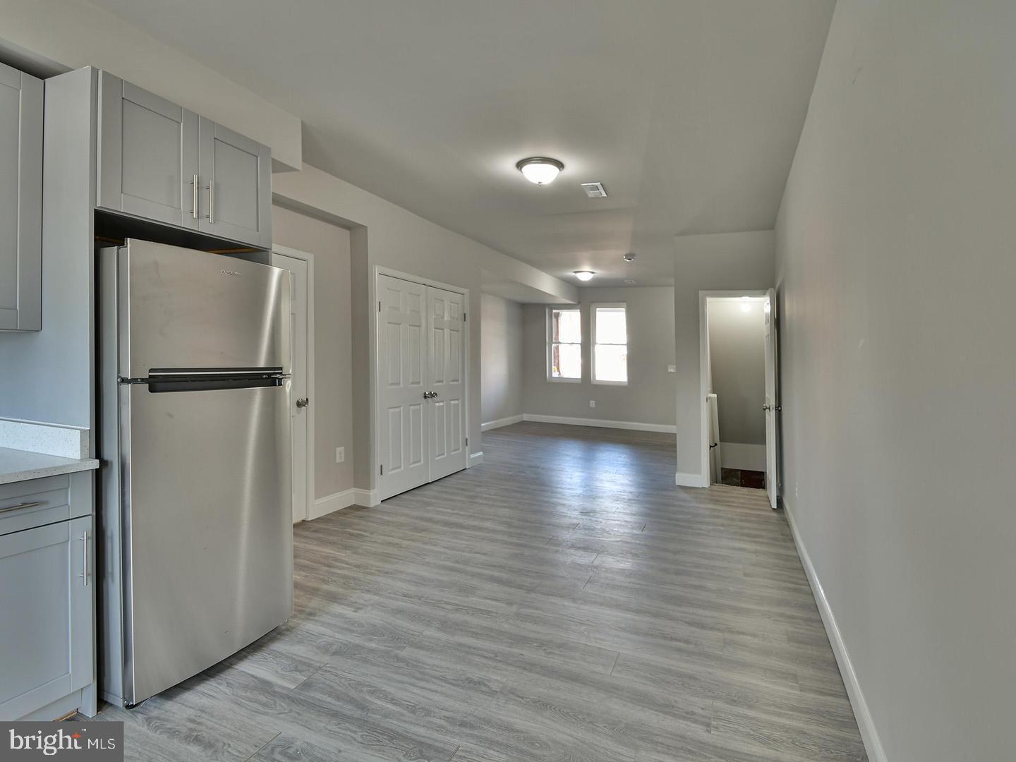 2605 Kirk Avenue Baltimore, MD 21218 - Photo 3 of 17 a view of a kitchen with a refrigerator and wooden floor