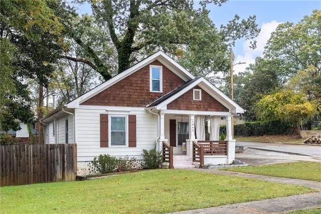 a front view of a house with a yard table and chairs