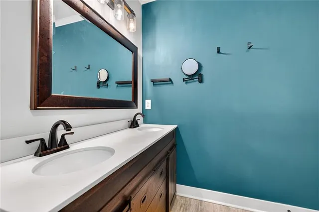 a bathroom with a sink and mirror