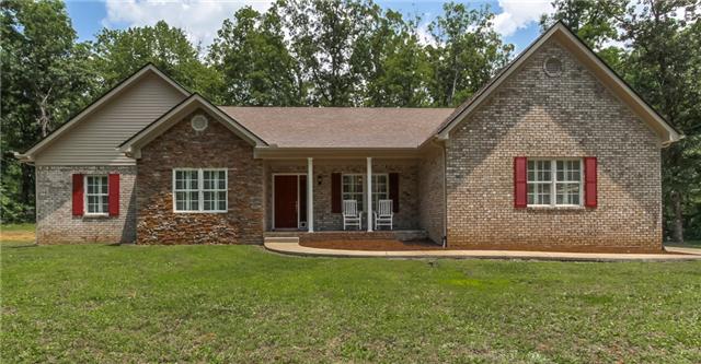 7876 Oscar Green Road Primm Springs, TN 38476 - Photo 1 of 20 All brick home with covered front porch, back patio, concrete sidewalks and attached garage. Zoned for Fairview schools