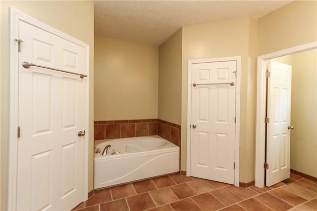 7876 Oscar Green Road Primm Springs, TN 38476 - Photo 13 of 20 Master bath features a jetted tub and his and her walk-in closets