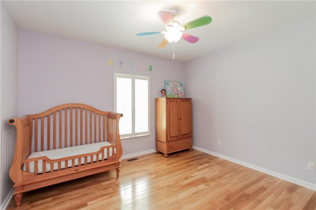 7876 Oscar Green Road Primm Springs, TN 38476 - Photo 17 of 20 13x12 bedroom with hardwood floors and ceiling fan