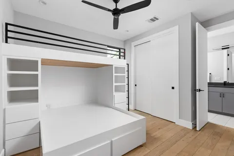 a bathroom with a sink a toilet and a window