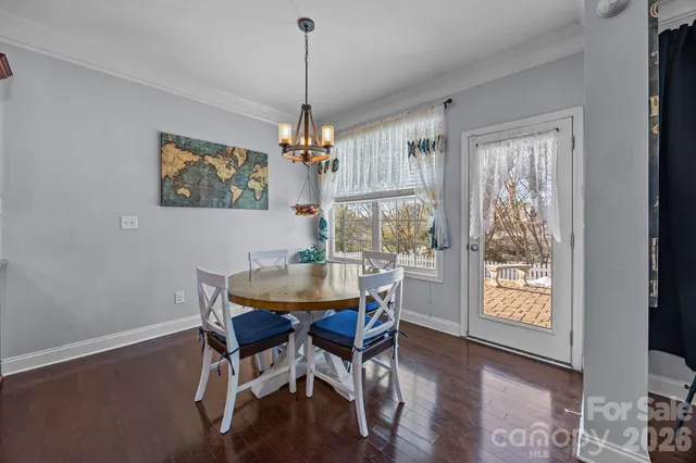 a kitchen with stainless steel appliances granite countertop a sink refrigerator and cabinets
