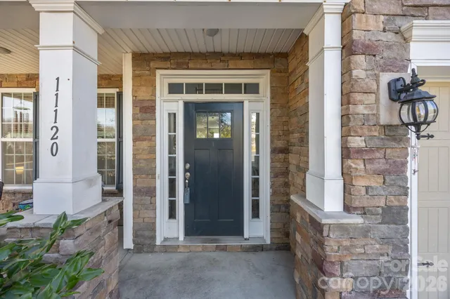 a living room with furniture and window