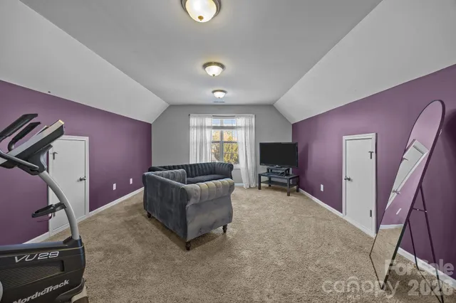 a bed room with a bed and a ceiling fan