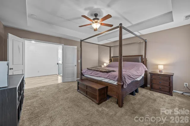 a spacious bathroom with a granite countertop sink and a mirror
