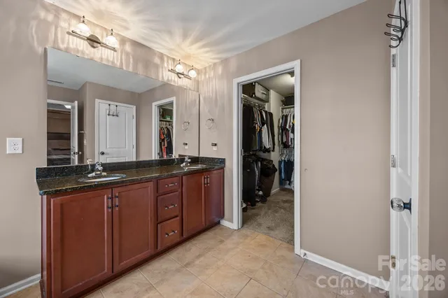 a bathroom with a glass shower door