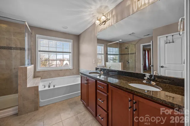 a bathroom with a sink and a window