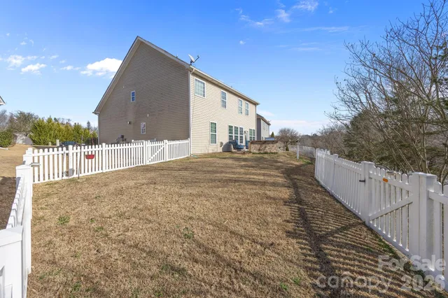 a view of a deck with a table and chairs