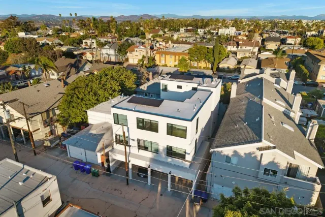 an aerial view of a house with a swimming pool