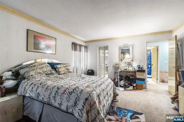 a bed room with a bed and a furniture