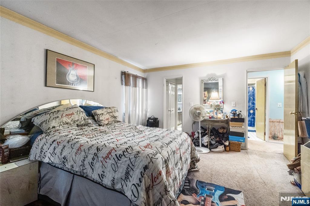 468 A Liberty Street, Unit 101 Little Ferry, NJ 07643 - Photo 14 of 22 a bed room with a bed and a furniture