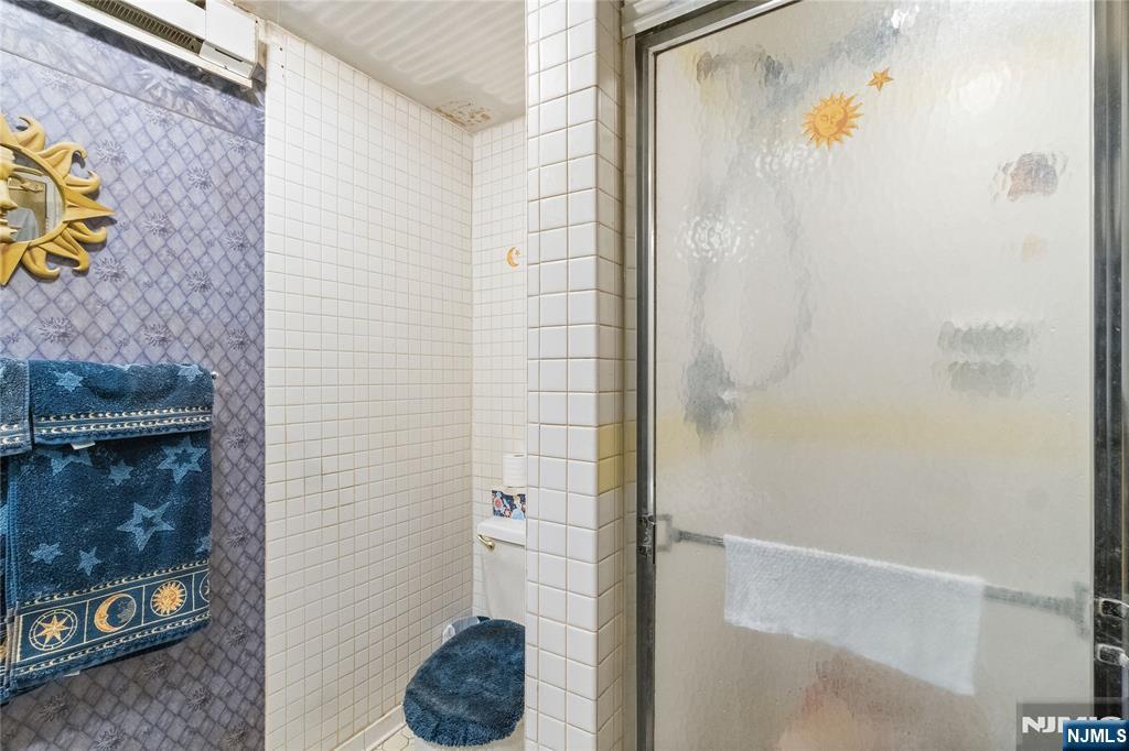 468 A Liberty Street, Unit 101 Little Ferry, NJ 07643 - Photo 16 of 22 a bathroom with a shower