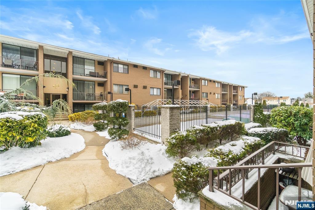 468 A Liberty Street, Unit 101 Little Ferry, NJ 07643 - Photo 20 of 22 a view of a patio with couches table and chairs and potted plants
