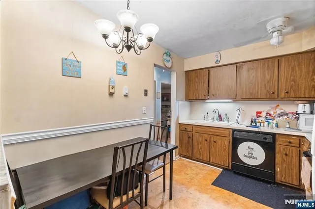 a utility room with cabinets washer and dryer