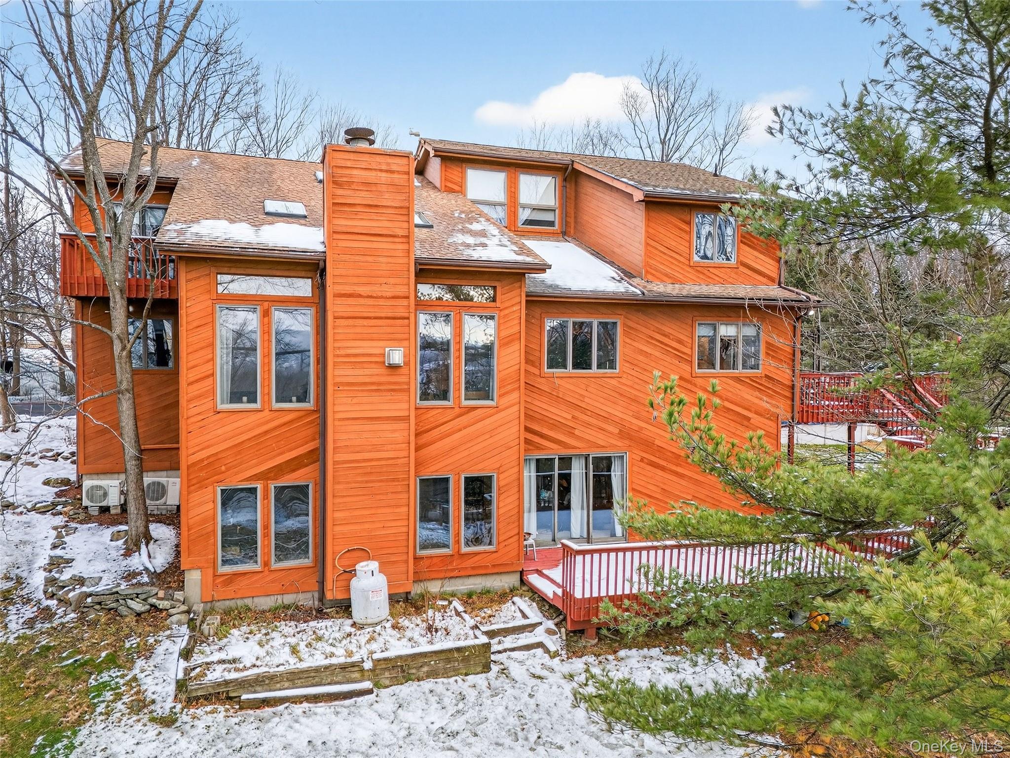 a front view of a residential apartment building with a yard