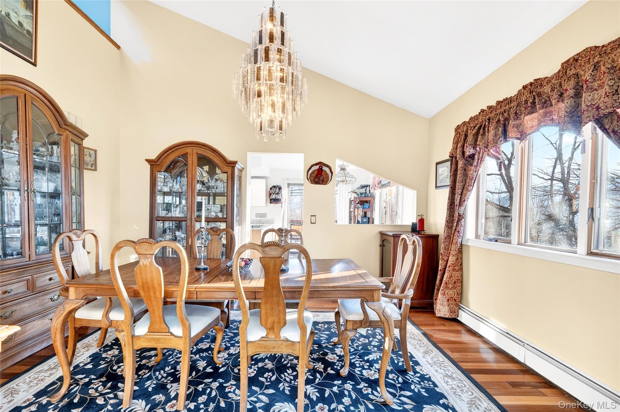 254 Orrs Mills Road Cornwall, NY 12553 - Photo 14 of 50 a view of a dining room with furniture and chandelier