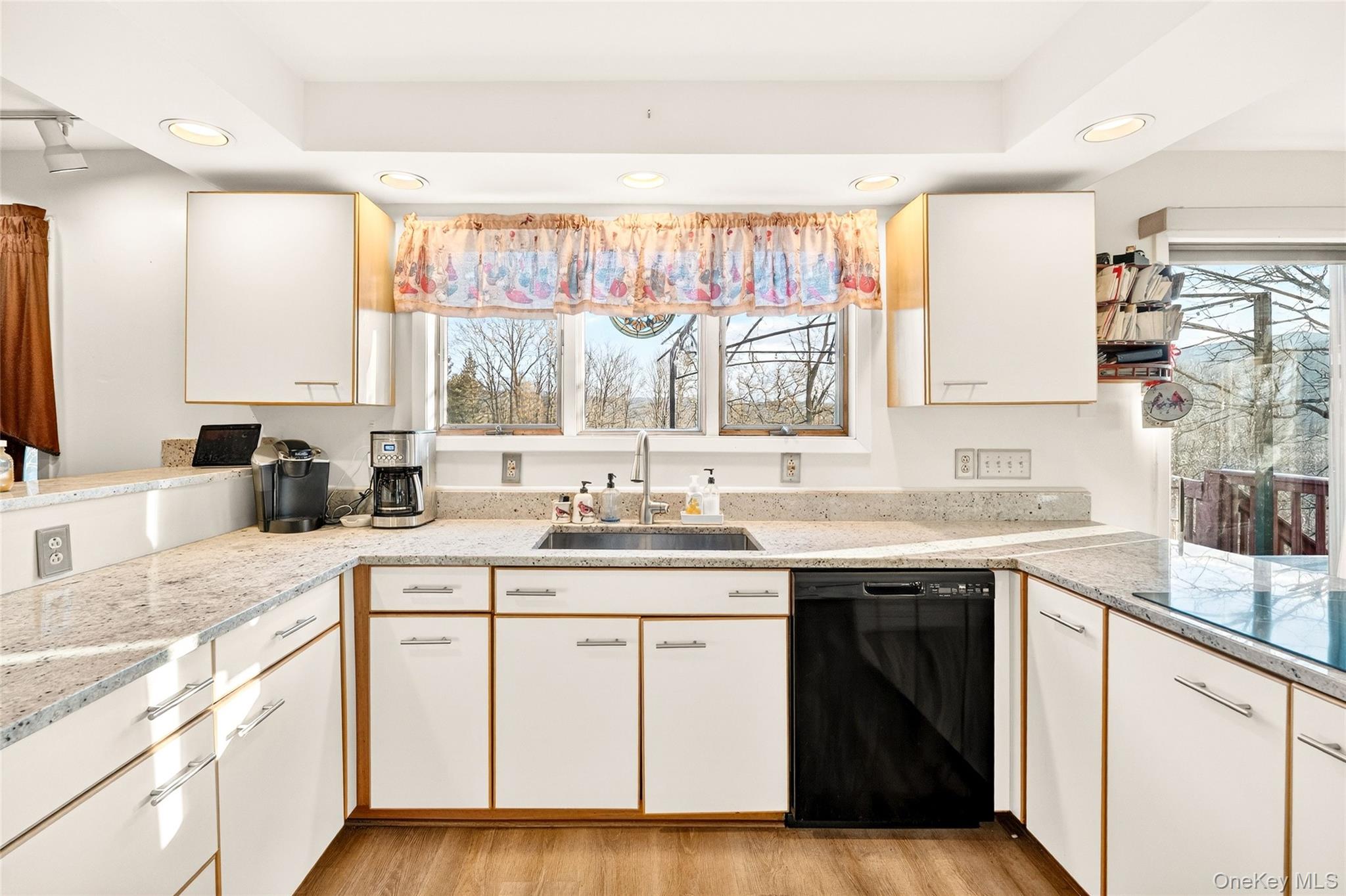 254 Orrs Mills Road Cornwall, NY 12553 - Photo 18 of 50 a kitchen with a sink stove and cabinets