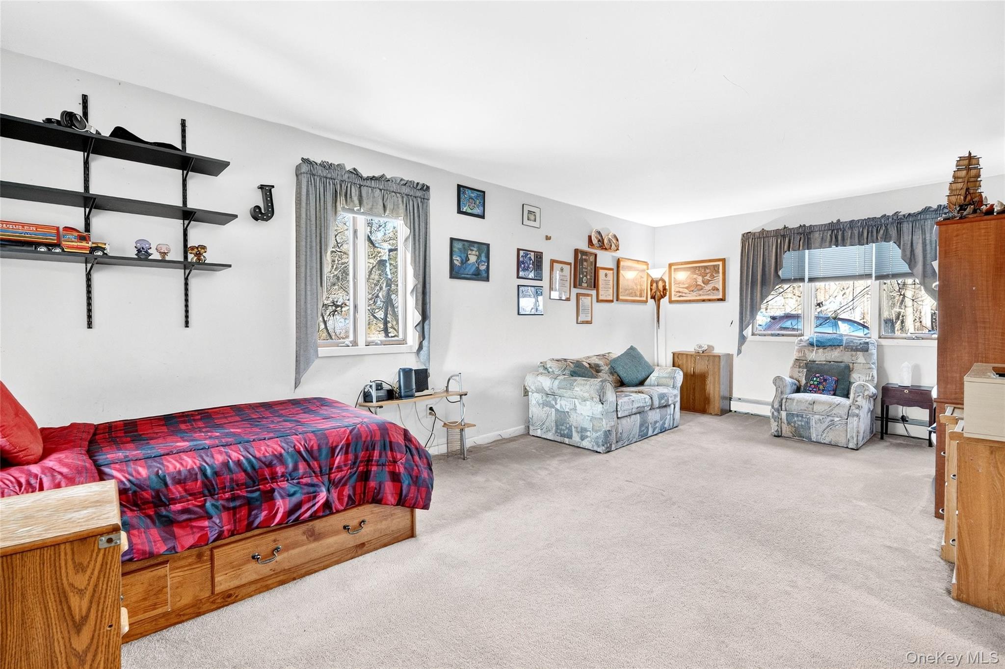 254 Orrs Mills Road Cornwall, NY 12553 - Photo 23 of 50 a bedroom with furniture and a large window