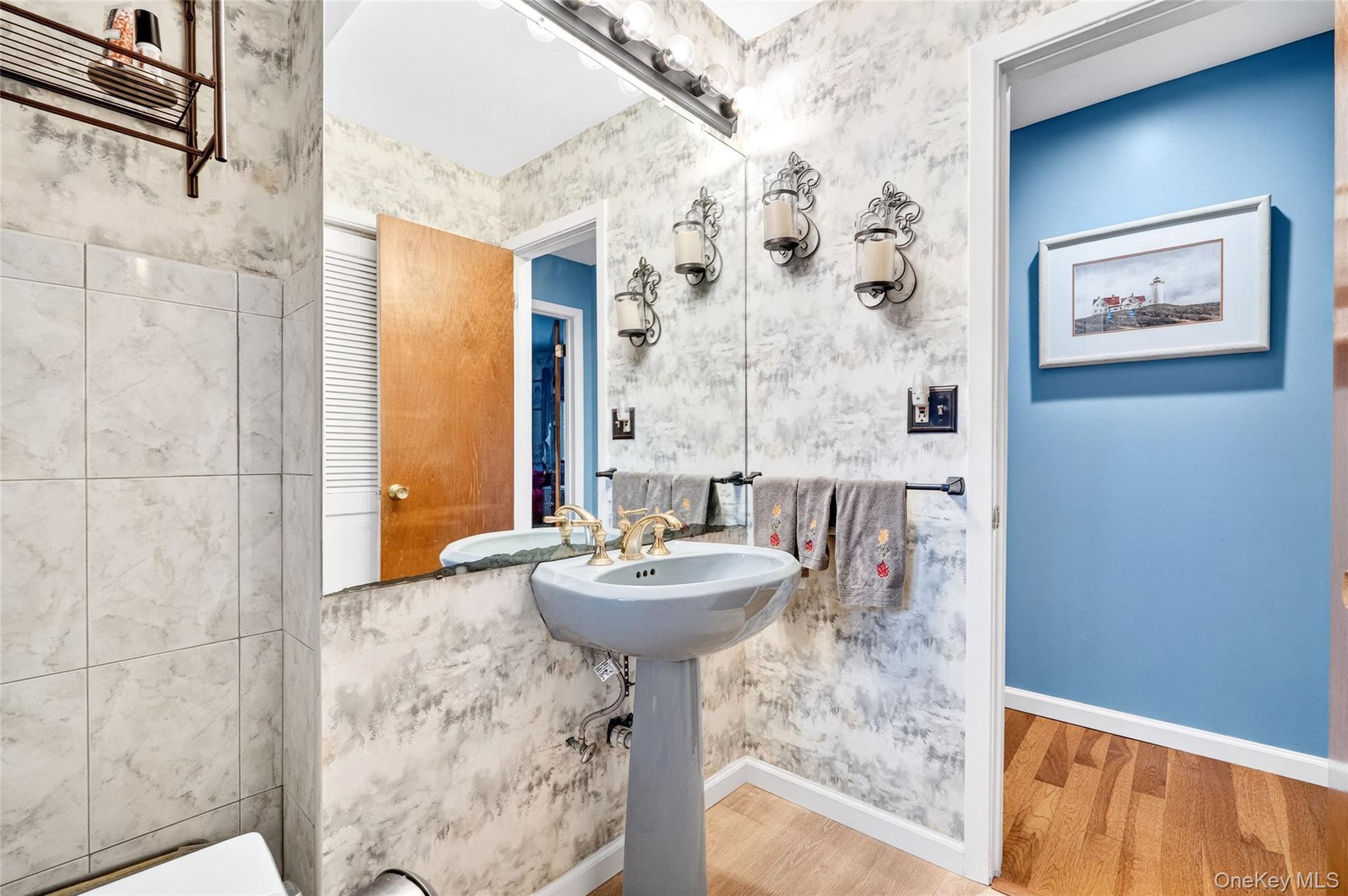 254 Orrs Mills Road Cornwall, NY 12553 - Photo 24 of 50 a bathroom with a sink a mirror and a shower