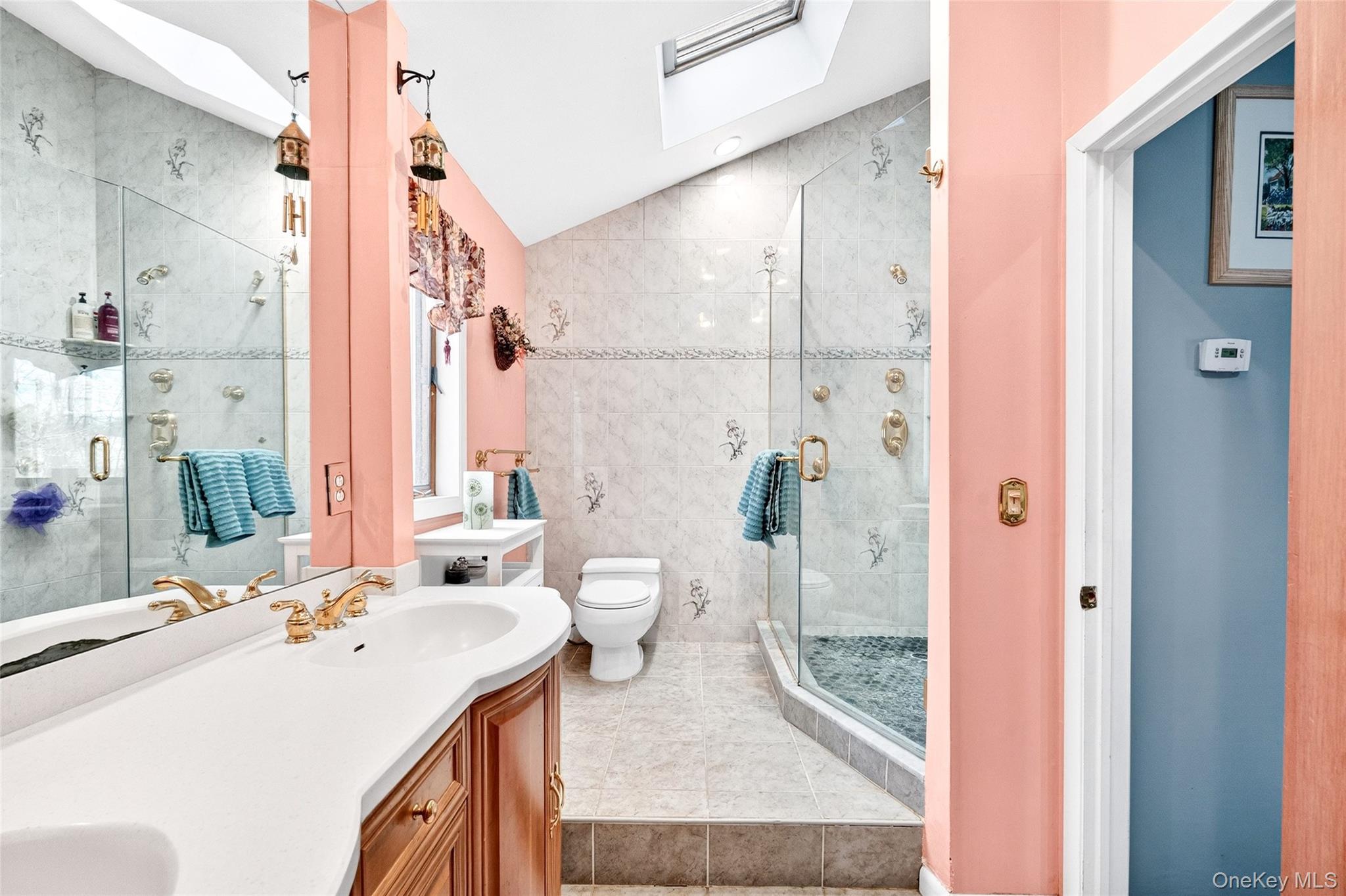 254 Orrs Mills Road Cornwall, NY 12553 - Photo 29 of 50 a bathroom with a sink a toilet and shower