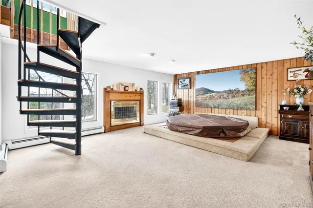 a bedroom with a bed and a chair in it