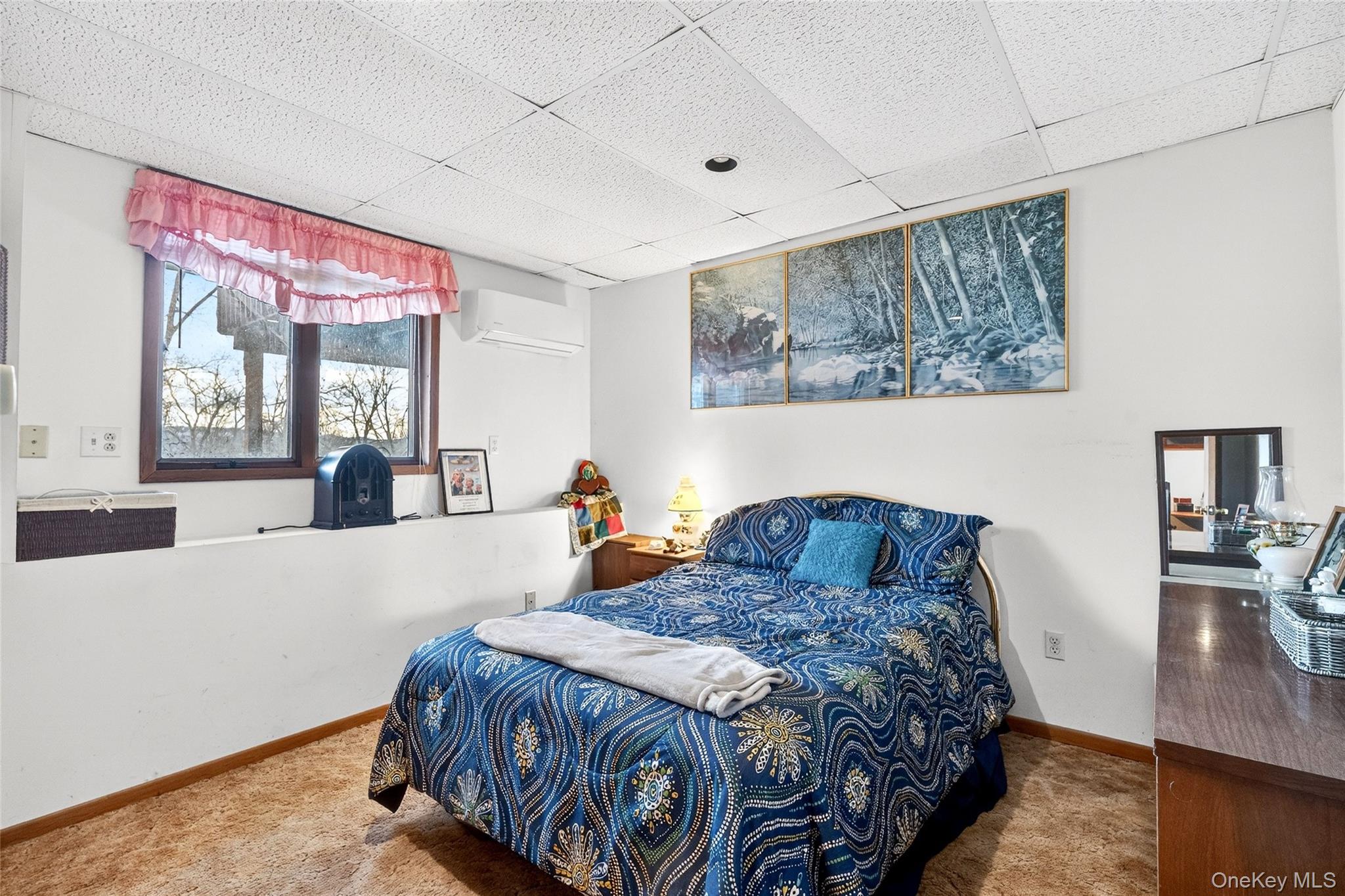 254 Orrs Mills Road Cornwall, NY 12553 - Photo 39 of 50 a bedroom with a bed and a large mirror on the dresser