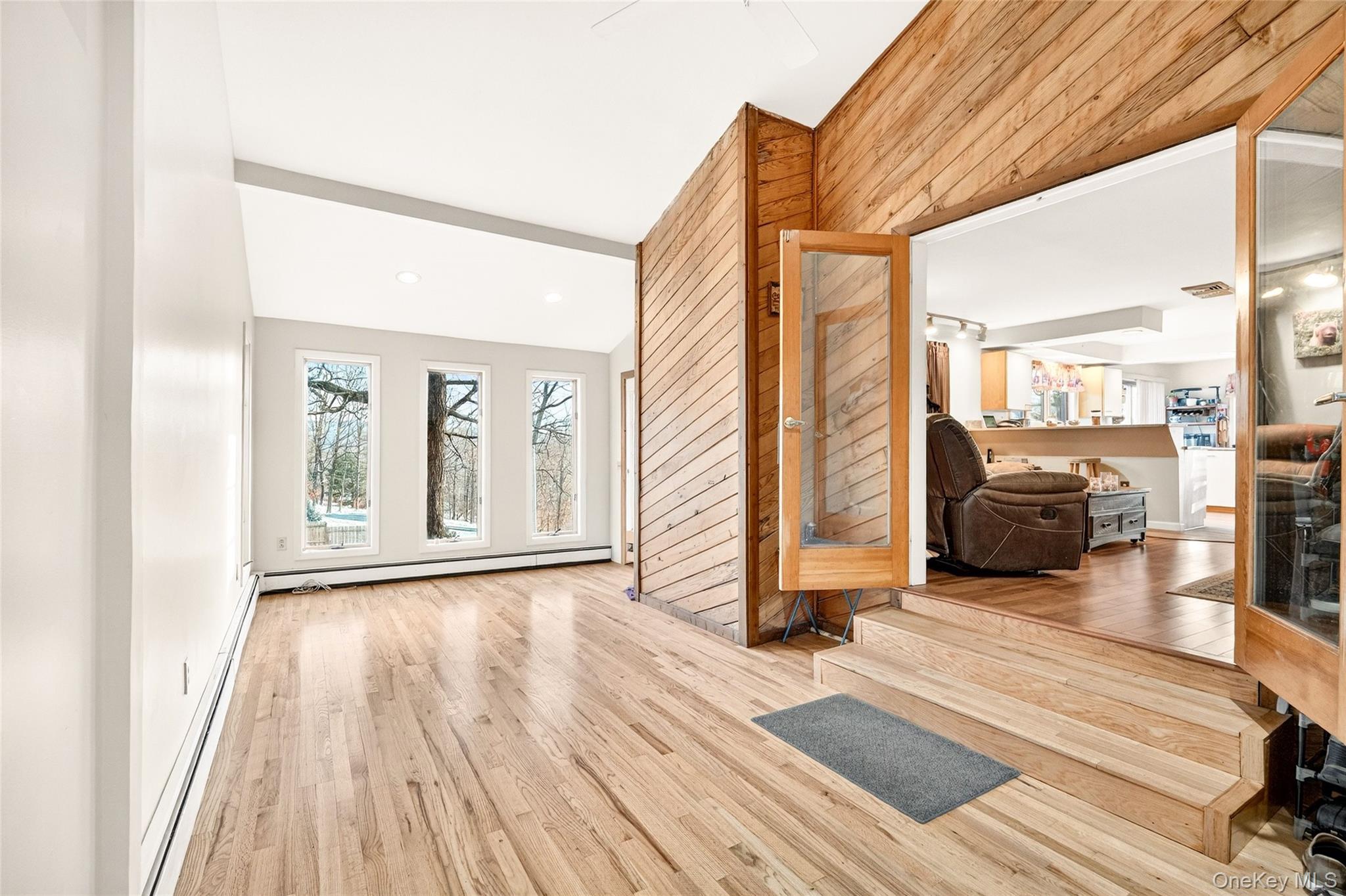 254 Orrs Mills Road Cornwall, NY 12553 - Photo 8 of 50 a view of a hallway with wooden floor and furniture